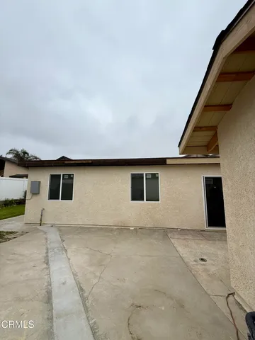 a house view with a backyard space