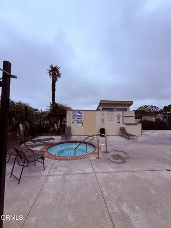 a view of a terrace with furniture and a table
