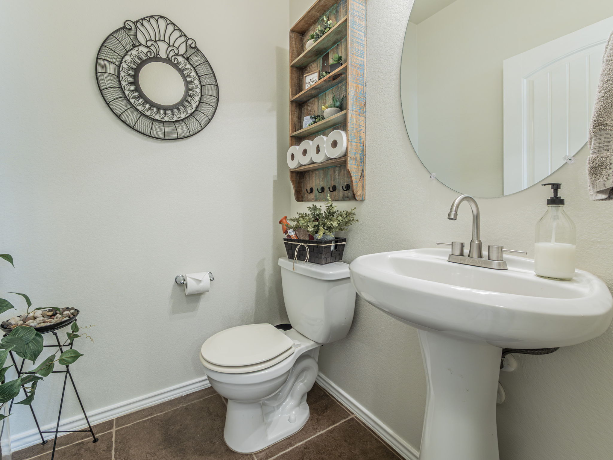 1366 Heep Run Buda, TX 78610 - Photo 25 of 35 Bathroom featuring baseboards and dark tile patterned flooring