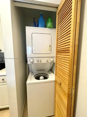 a view of a patio with a table and chairs