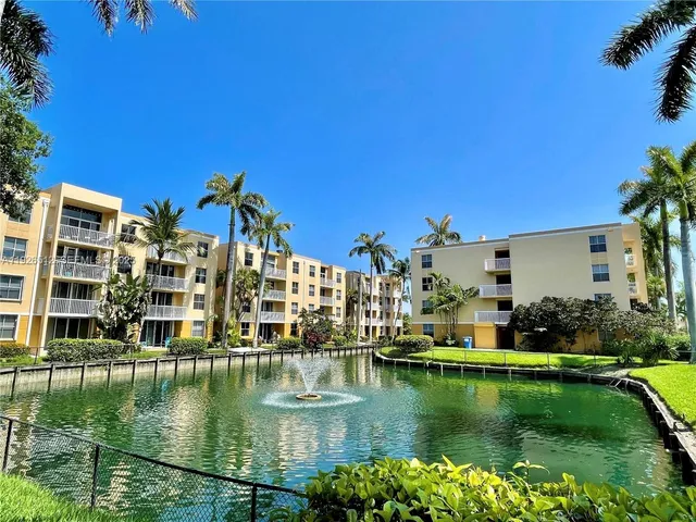 a kitchen with granite countertop a stove and a microwave
