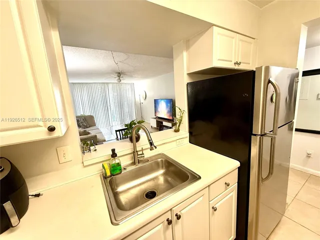 a kitchen with a stove and a microwave