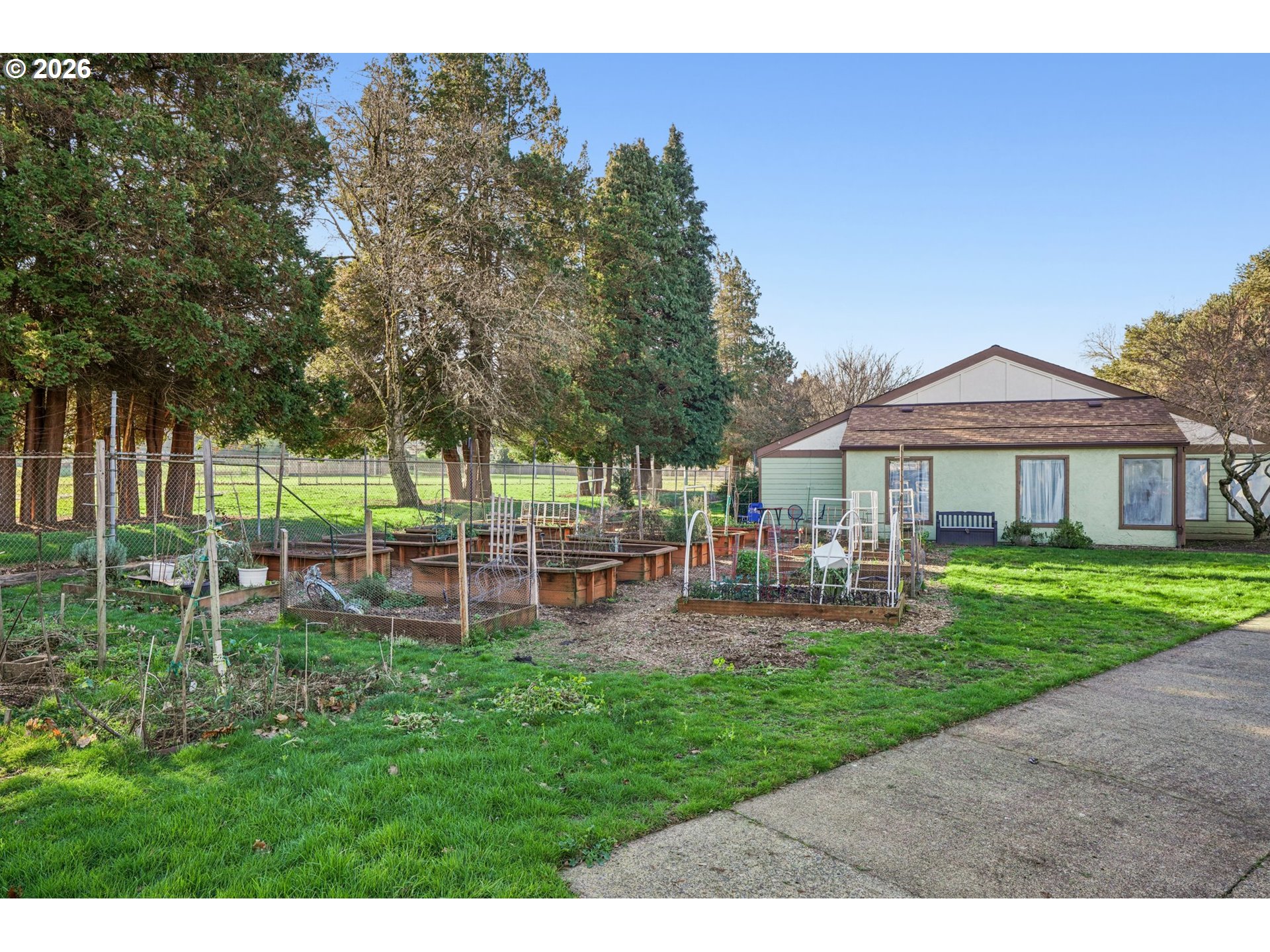 3383 Northeast 162nd Avenue Portland, OR 97230 - Photo 17 of 27 a front view of a house with a yard table and chairs