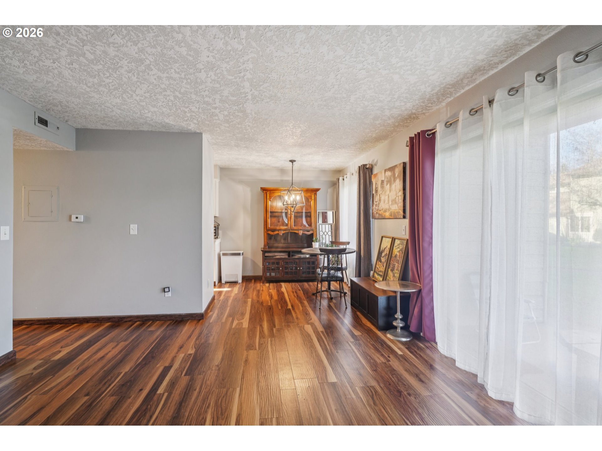 3383 Northeast 162nd Avenue Portland, OR 97230 - Photo 7 of 27 a big room with wooden floor and windows