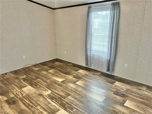 a bathroom with a granite countertop sink toilet and mirror