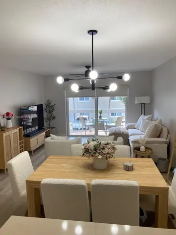 a bedroom with furniture and a flat screen tv