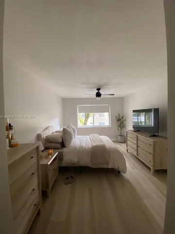 a bathroom with a shower and a sink
