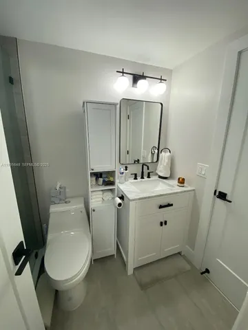 a kitchen with a sink a window and stainless steel appliances