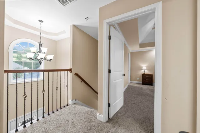 a view of a hallway view with staircase