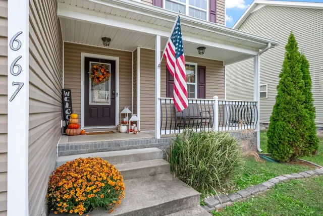 a front view of a house with garden