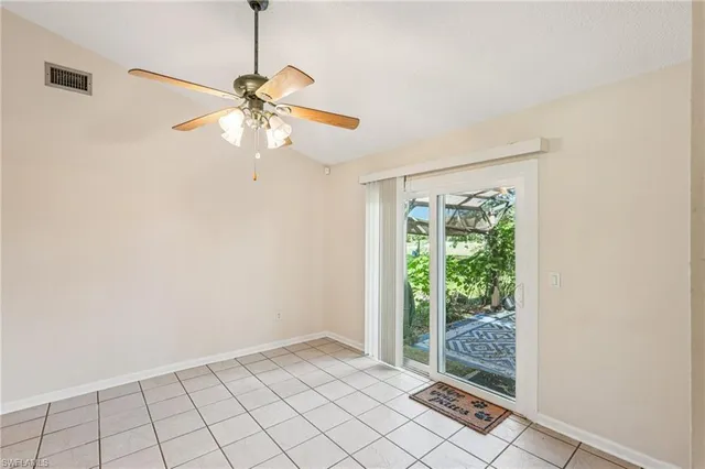 a large kitchen with stainless steel appliances a sink and cabinets
