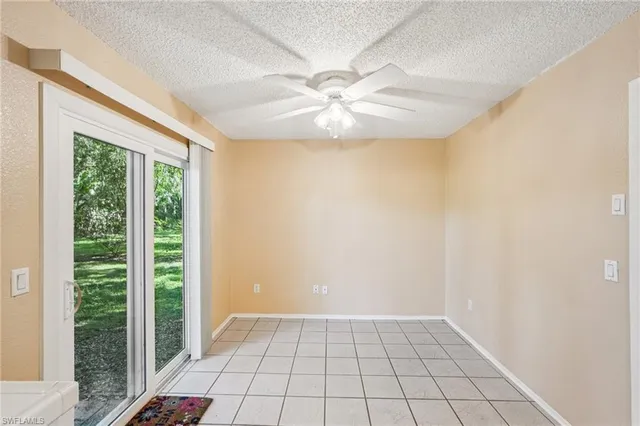 a spacious bathroom with a double vanity sink a mirror and a bathtub
