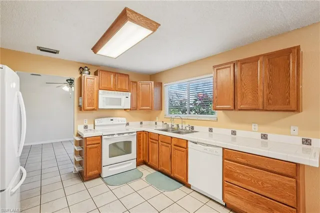 a view of a storage & utility room with a sink