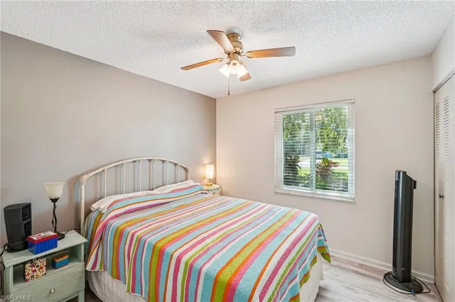 a room with a bed and a chandelier