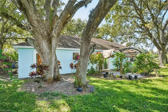 a backyard of a house with lots of green space