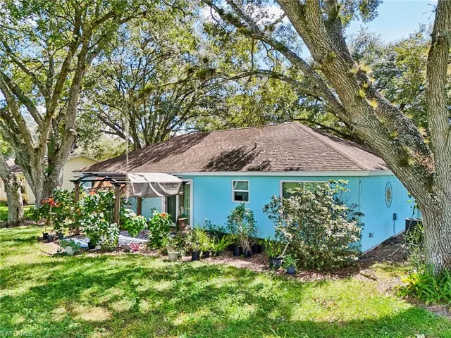a backyard of a house with lots of green space