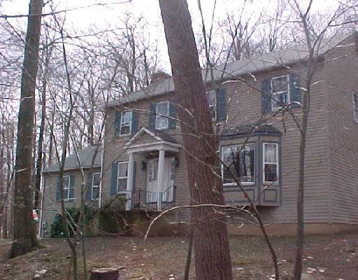 39 Buckspen Lane Ridgefield, CT 06877 - Photo 1 of 1 a front view of a house with yard