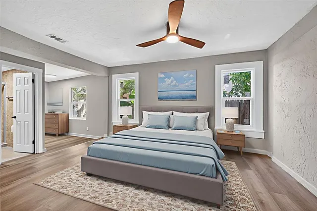 a bathroom with a toilet and a window