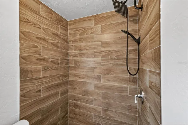 a view of a room with wooden walls