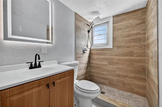 a kitchen with a refrigerator a stove top oven a sink and dishwasher