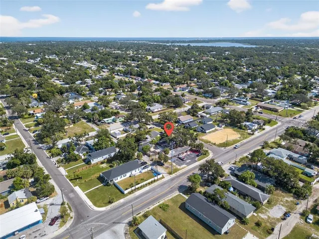 an aerial view of residential houses with outdoor space