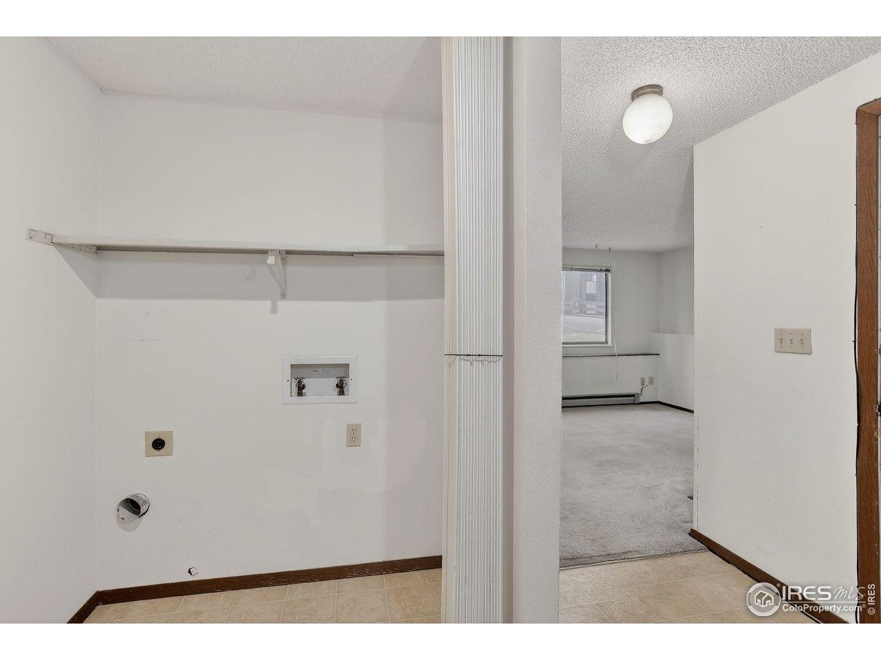 925 Columbia Road, Unit 716 Fort Collins, CO 80525 - Photo 12 of 17 a view of a bathroom with white walls