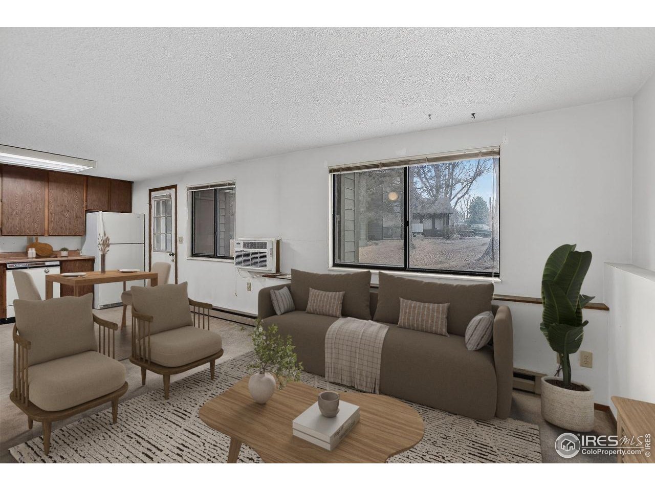 925 Columbia Road, Unit 716 Fort Collins, CO 80525 - Photo 4 of 17 a living room with furniture and a large window