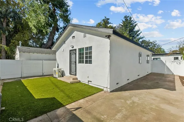 a view of backyard with a cabin