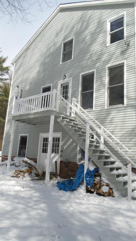 105 Blueberry Road Waterboro, ME 04087 - Photo 33 of 33 Back exterior of house side facing pond.