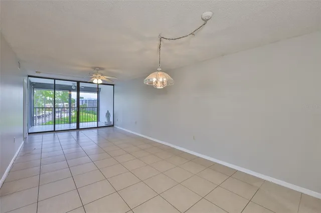 a view of a room with window and chandelier