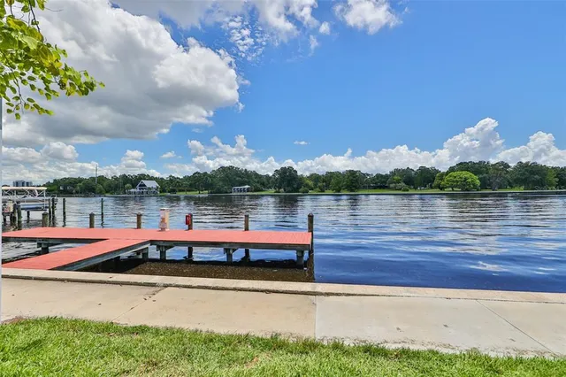 a view of a lake with houses in the background