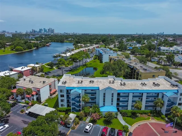 an aerial view of a house with a lake view