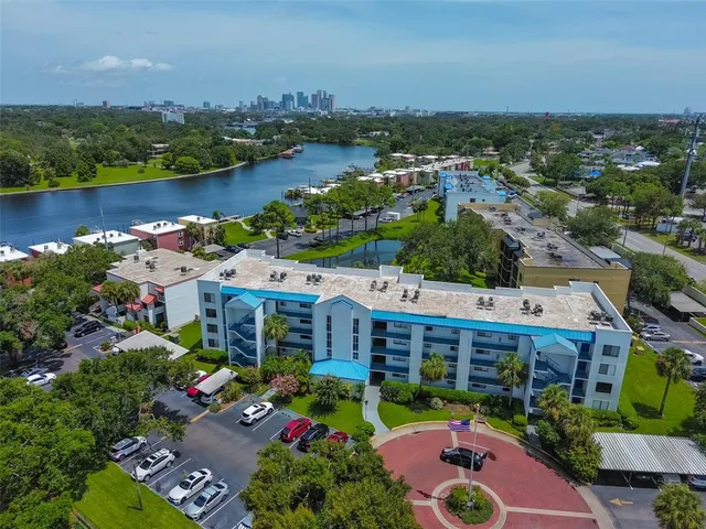 an aerial view of a house with a lake view