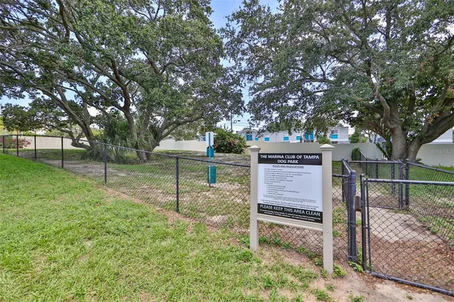a view of house with wooden fence