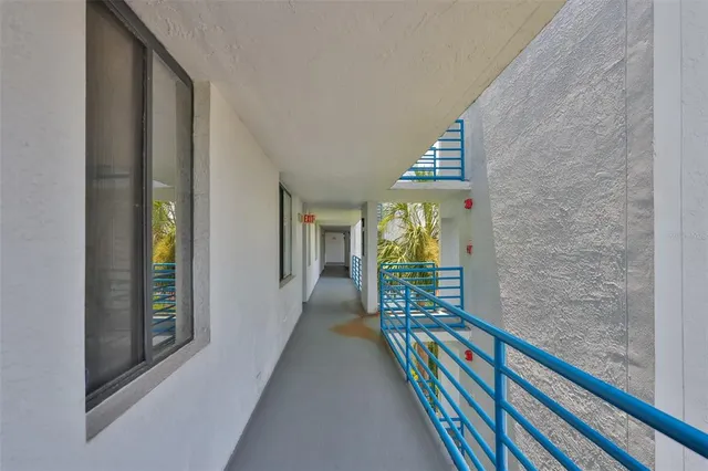 a stairs and a bed in a balcony