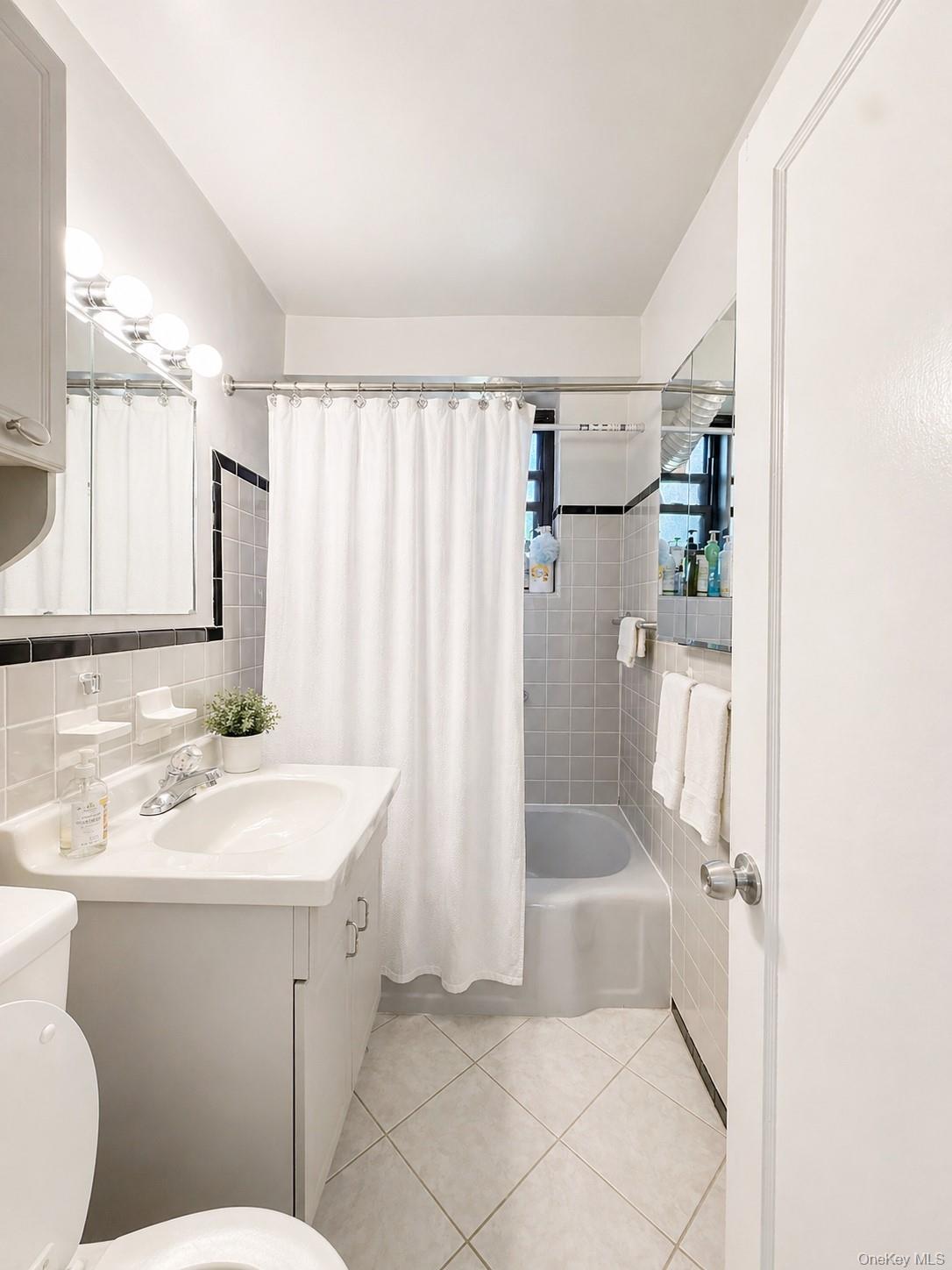 139-16 28th Road, Unit Z Queens, NY 11354 - Photo 11 of 14 a bathroom with a sink toilet and shower