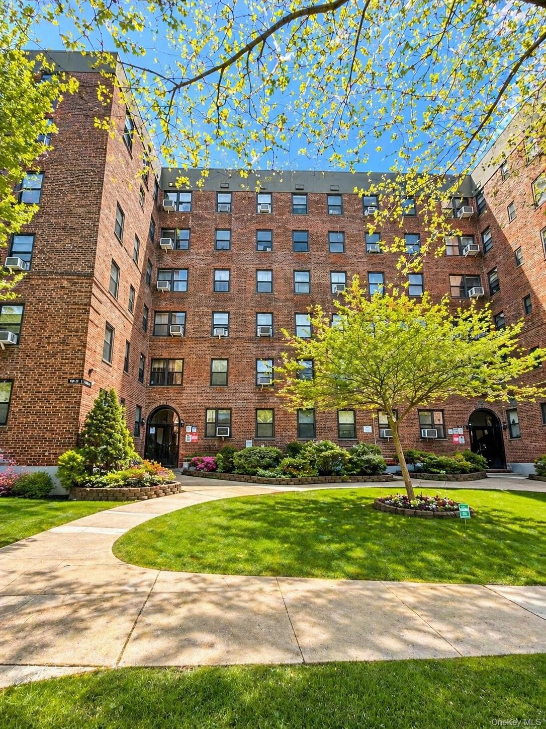 139-16 28th Road, Unit Z Queens, NY 11354 - Photo 14 of 14 a view of a building with a yard