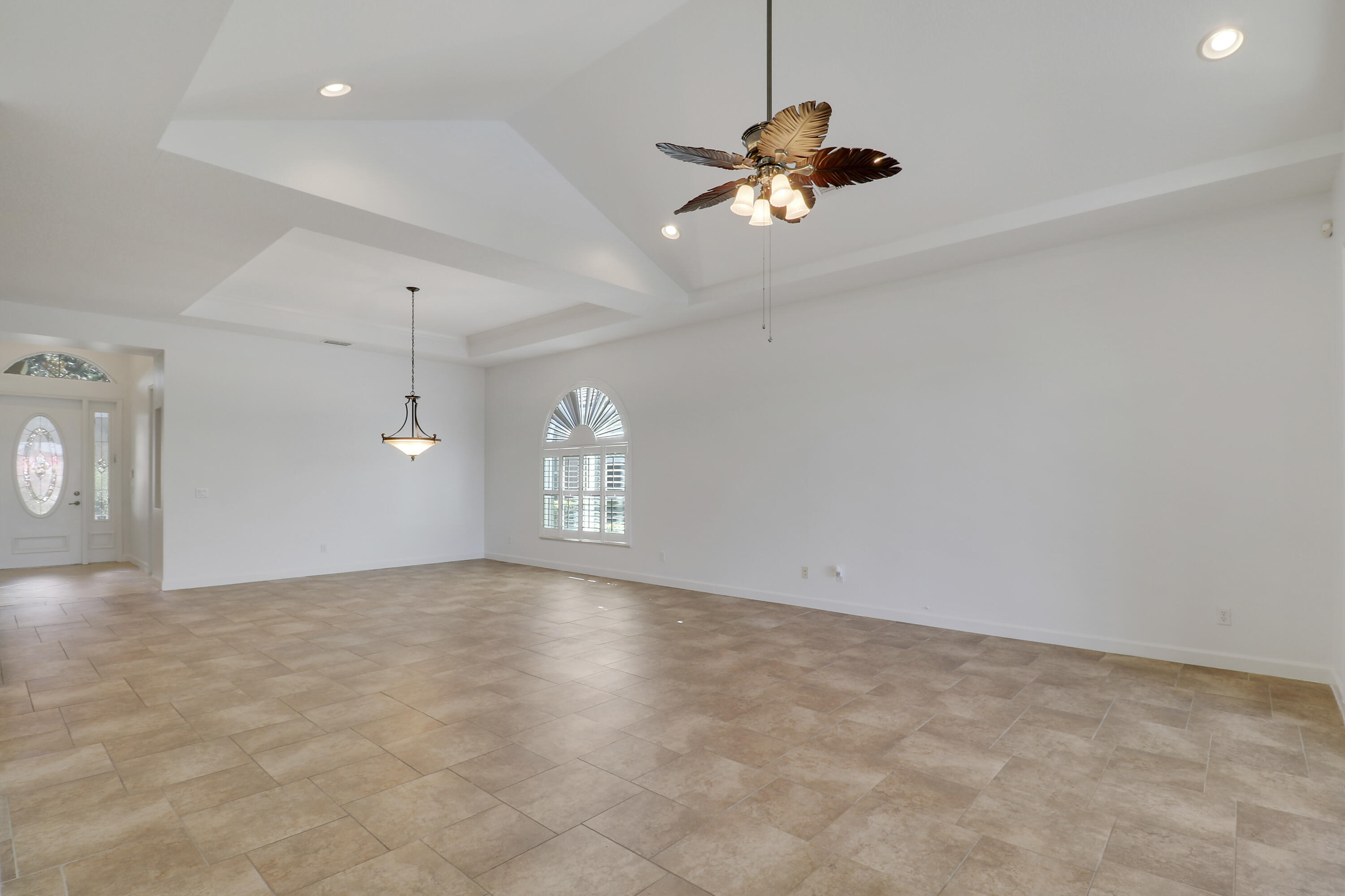 9212 Short Chip Circle Port St. Lucie, FL 34986 - Photo 20 of 71 an empty room with windows and fan
