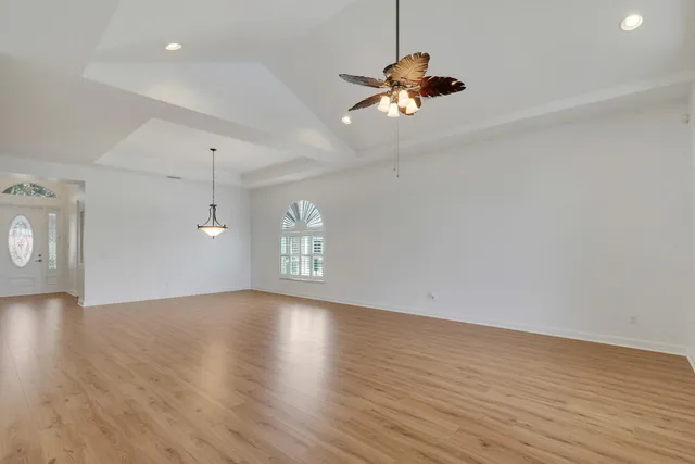 a view of room with hardwood floor and window