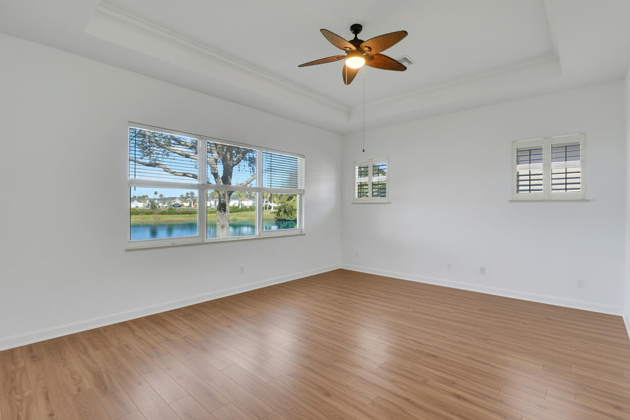 9212 Short Chip Circle Port St. Lucie, FL 34986 - Photo 24 of 71 a view of an empty room with window and wooden floor