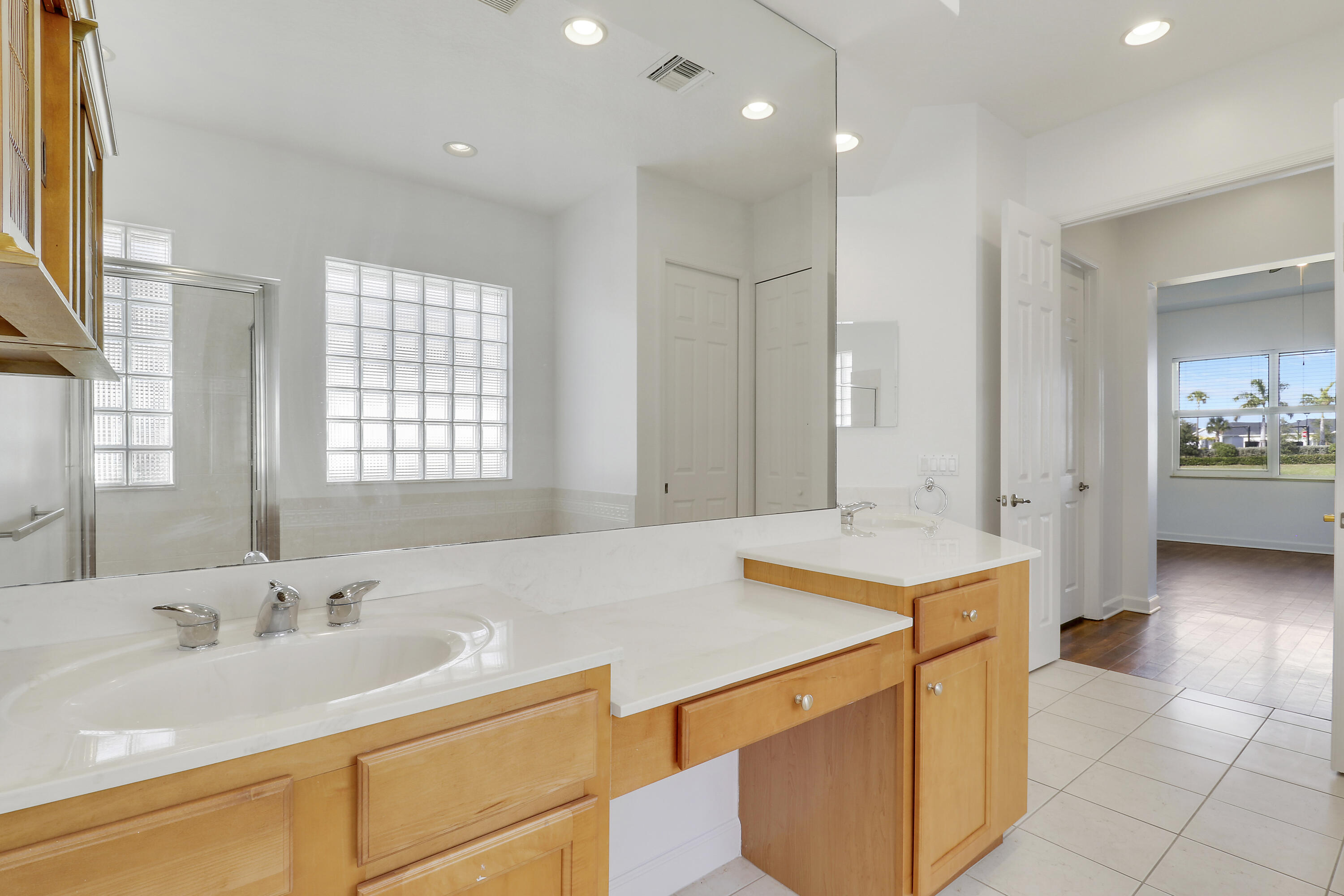 9212 Short Chip Circle Port St. Lucie, FL 34986 - Photo 31 of 71 a bathroom with a sink double vanity and a mirror