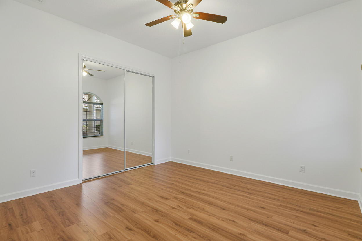 9212 Short Chip Circle Port St. Lucie, FL 34986 - Photo 33 of 71 wooden floor in an empty room with a window
