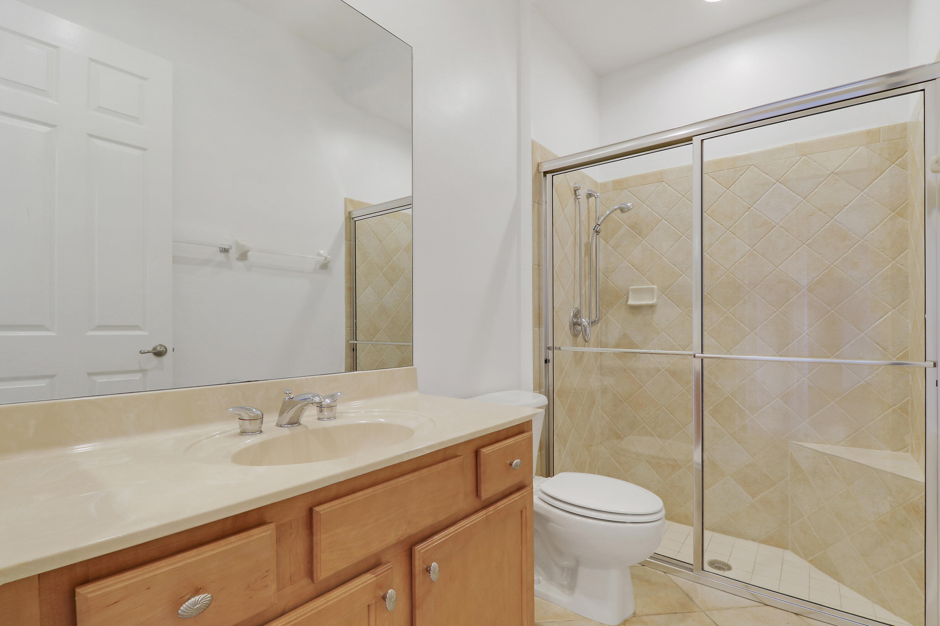9212 Short Chip Circle Port St. Lucie, FL 34986 - Photo 35 of 71 a bathroom with a sink toilet and shower