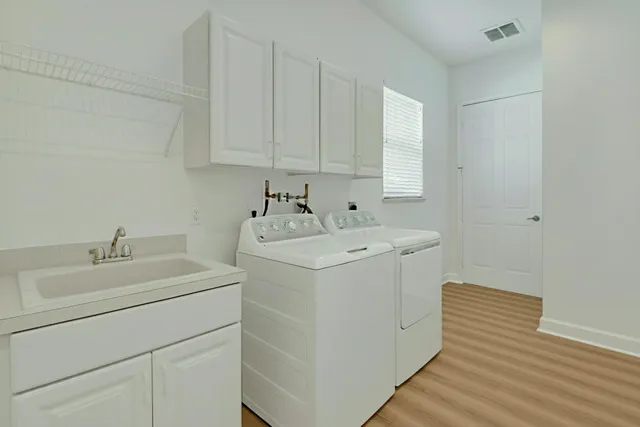 a view of a chairs and table in backyard