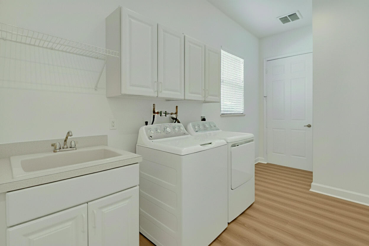 9212 Short Chip Circle Port St. Lucie, FL 34986 - Photo 40 of 71 a utility room with dryer and washer