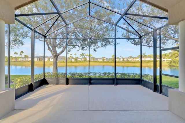 a view of a swimming pool with a table and chairs