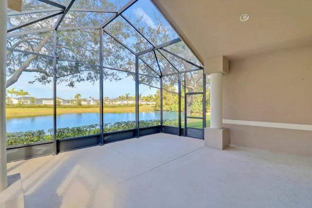 a view of outdoor space with trees yard patio and swimming pool