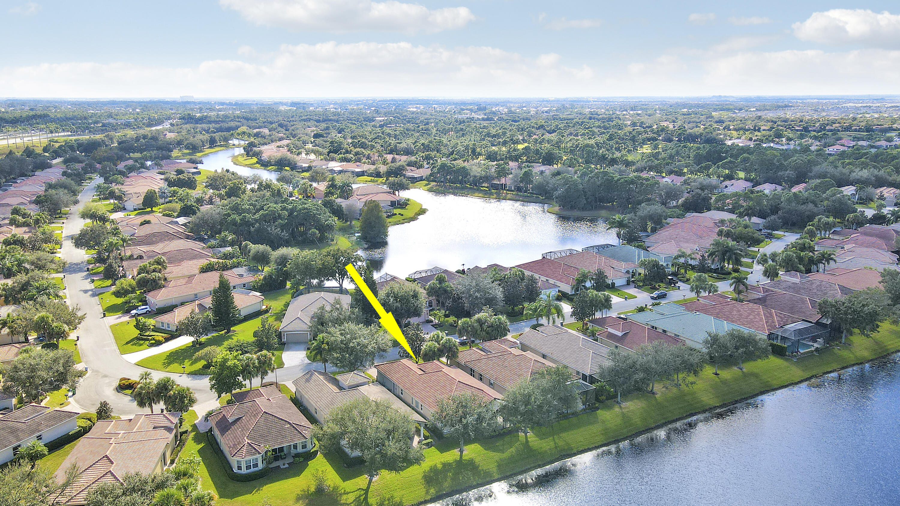 9212 Short Chip Circle Port St. Lucie, FL 34986 - Photo 47 of 71 an aerial view of residential houses with outdoor space and river