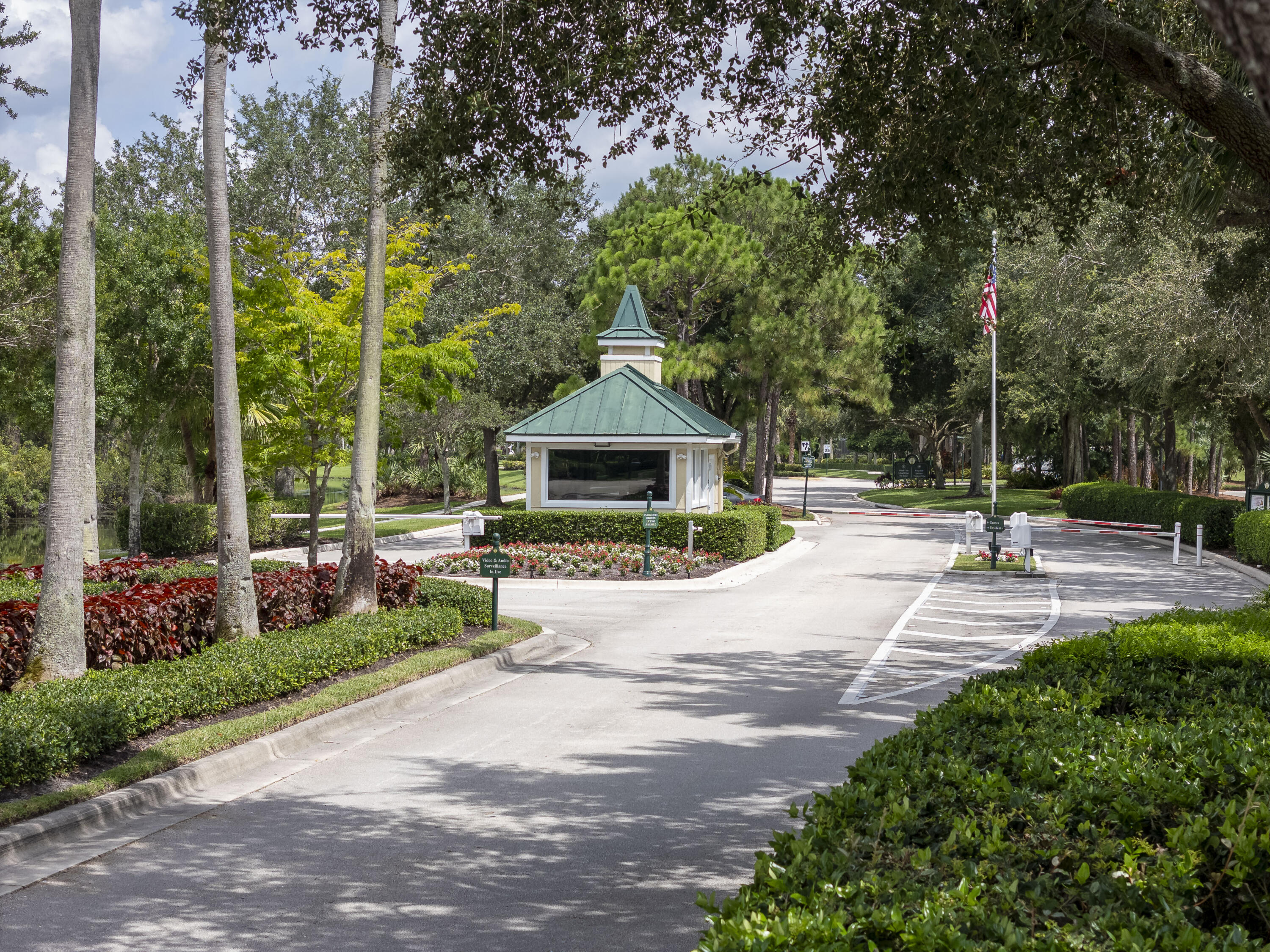 9212 Short Chip Circle Port St. Lucie, FL 34986 - Photo 50 of 71 a front view of a house with garden and trees