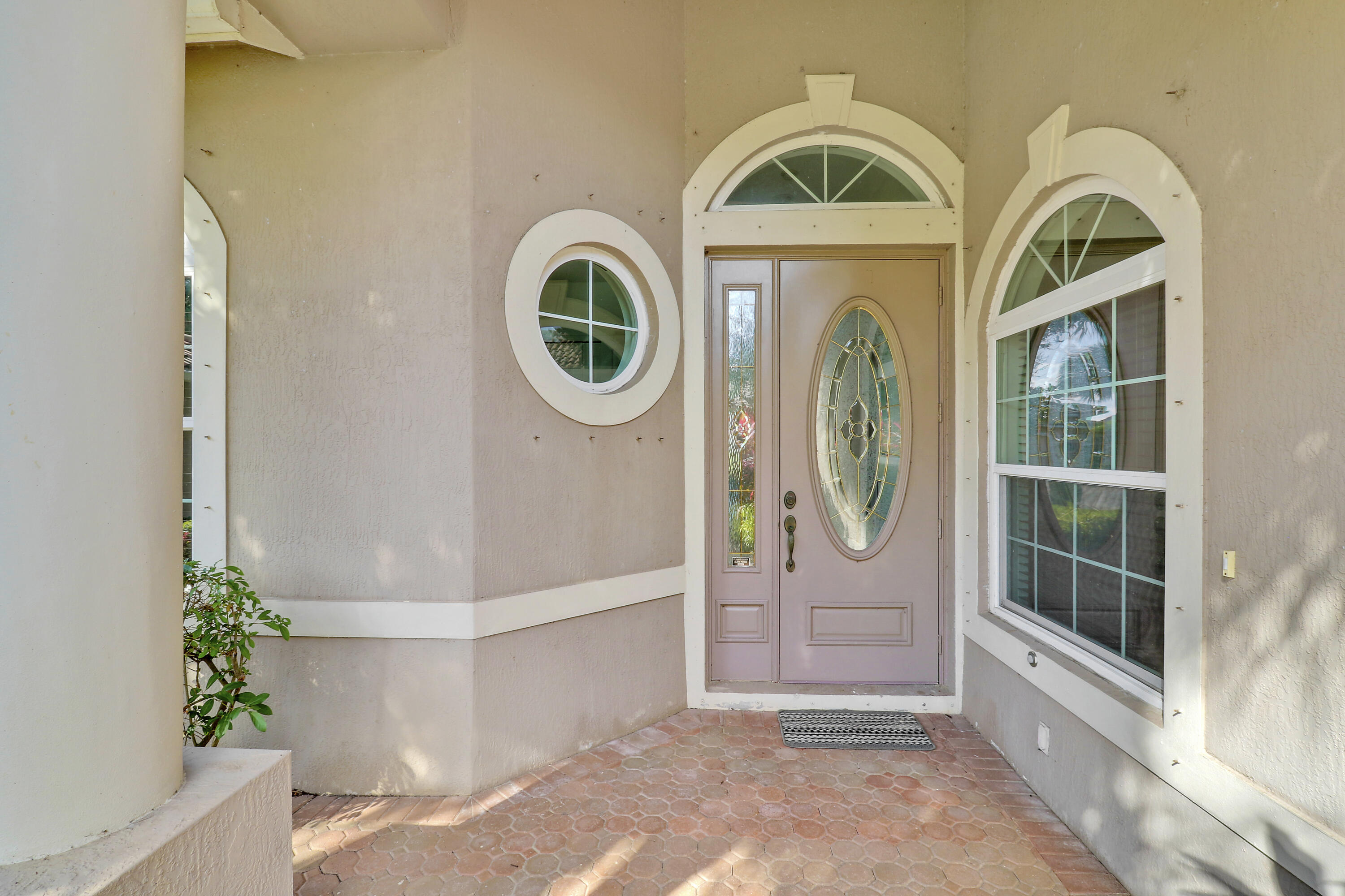 9212 Short Chip Circle Port St. Lucie, FL 34986 - Photo 5 of 71 a view of a door of a house with a outdoor space